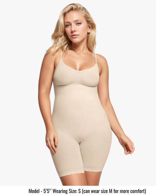 Woman wearing a beige shapewear bodysuit on a white background