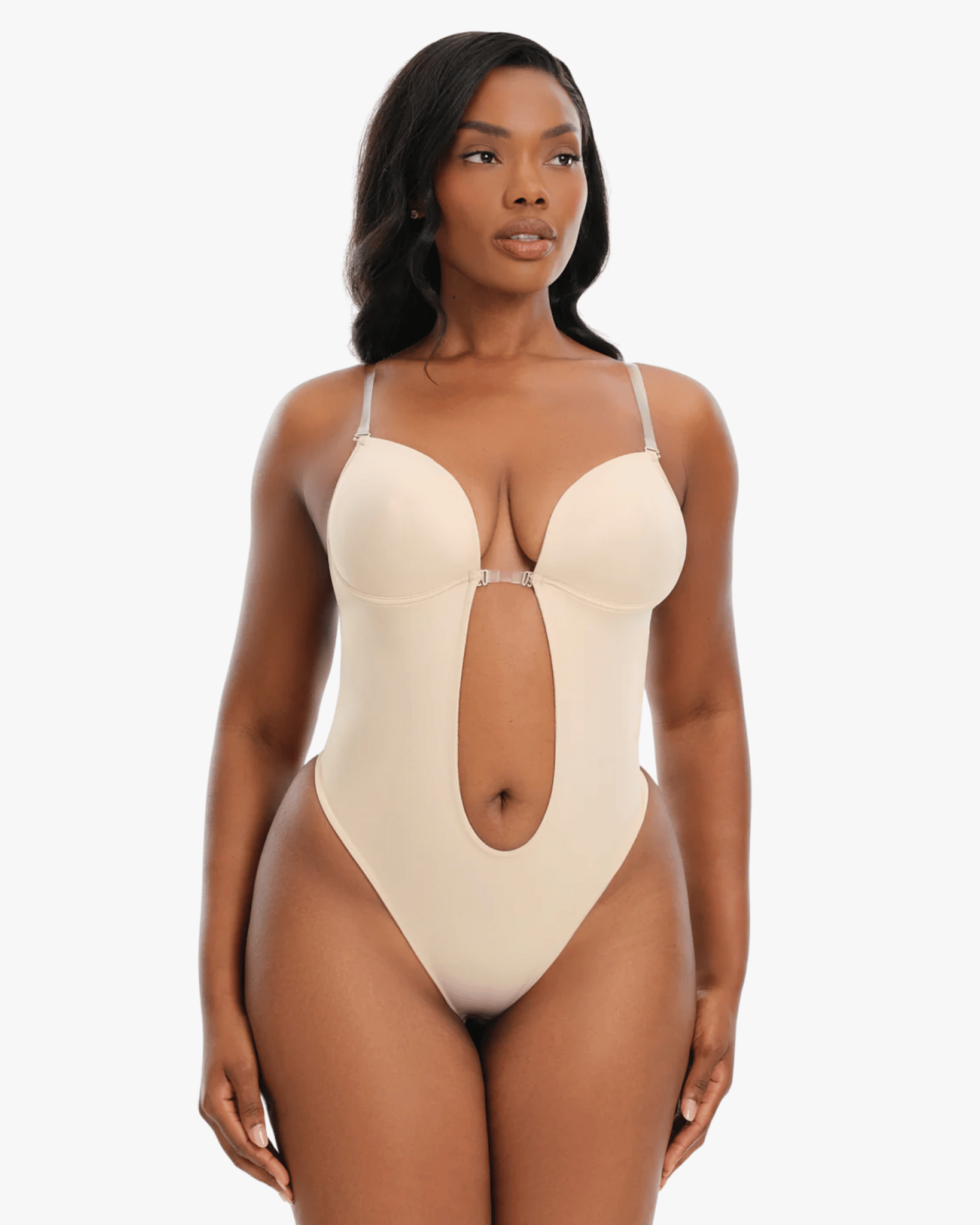 Woman wearing a beige one-piece swimsuit on a white background