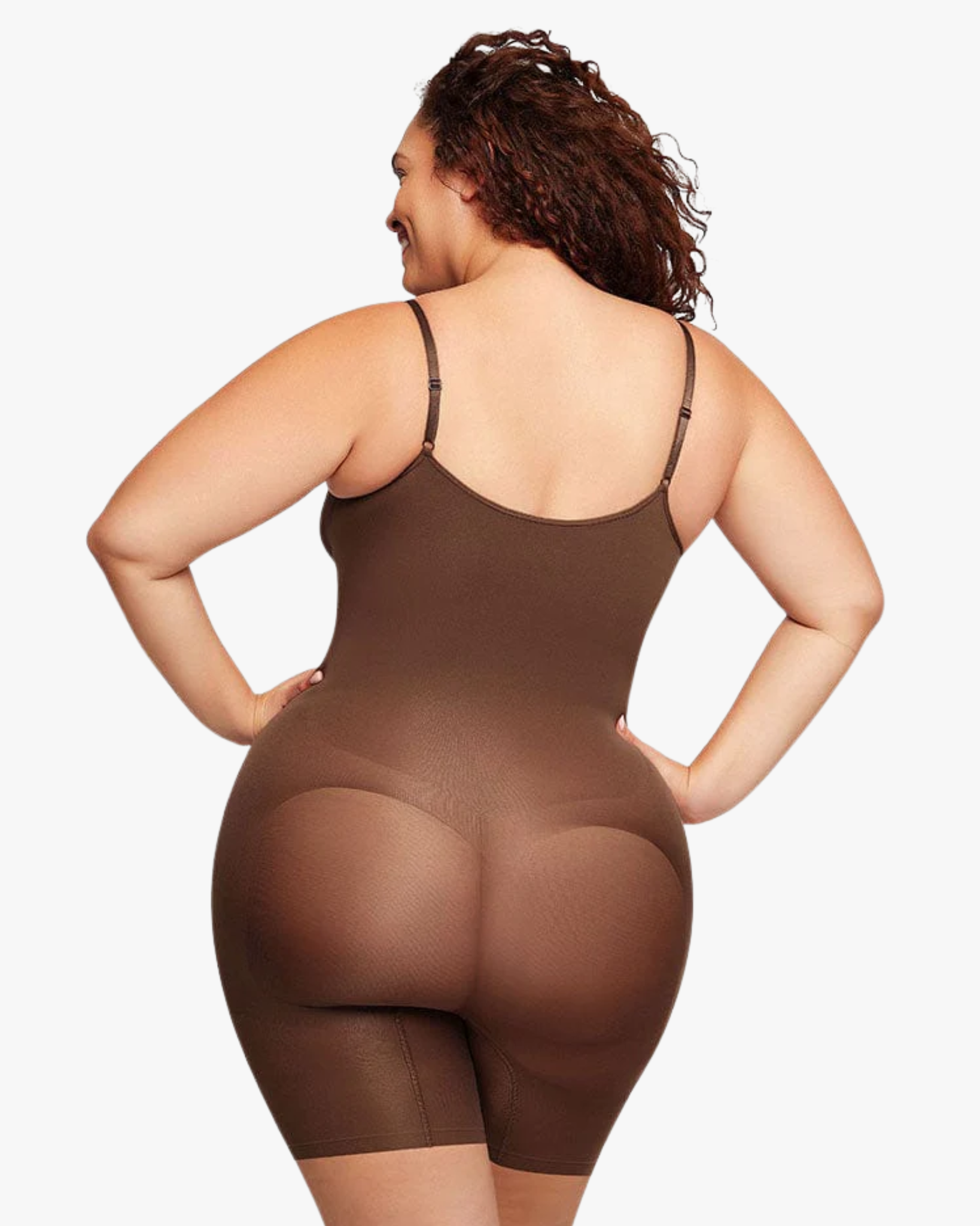 Person wearing a brown bodysuit on a white background