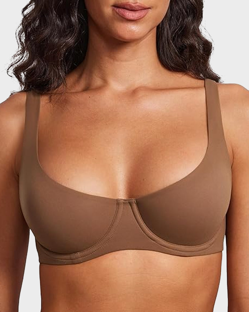 Brown bra worn by a model on a plain background